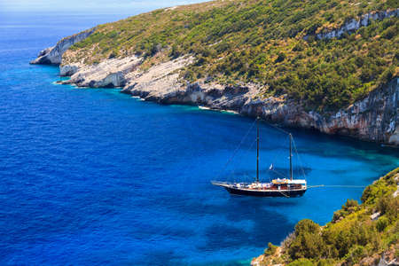 Luxurious ship in a bay on the island of Zakynthos with beautiful blue watersの写真素材