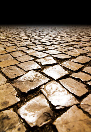 Detail of the cobble stones in the streets of Lisbon, Portugal, at sunset in summerの写真素材