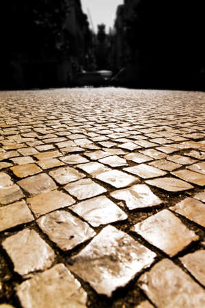 Detail of the cobble stones in the streets of Lisbon, Portugal, at sunset in summerの写真素材