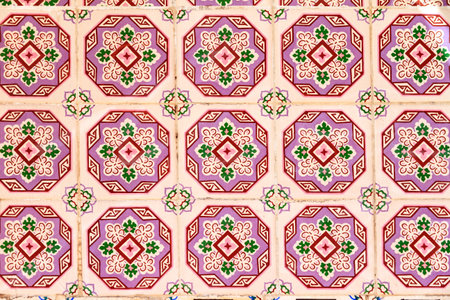 Close up image of the beautifully decorated tiles on the houses in the streets of Lisbon, Portugal
