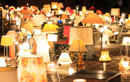 A gathering of lamps and lights at nightの写真素材