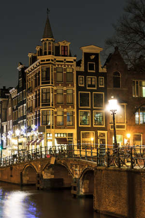Moody night shot at the canals in Amsterdam, the Netherlandsの写真素材