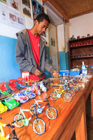 A Malagasy craftsman creates toys from scrap metal in Ambatolampy, Madagascar, on September 5, 2013のeditorial素材