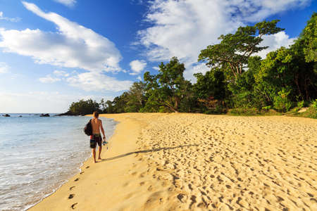 Young man on a beautiful isolated tropical beach in Masoala, Madagascarの写真素材