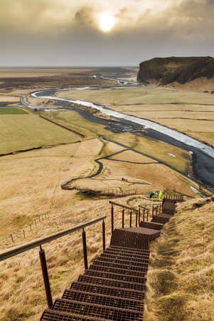 Staircase to the top of the Skogafoss waterfall in Icelandの写真素材