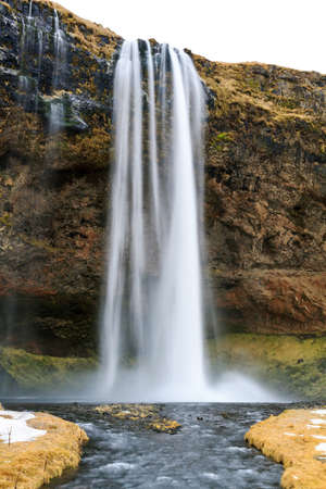Beautiful view of the Seljalandsfoss waterfall in Iceland in winterの写真素材