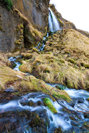 Beautiful view on a cascade near the Seljalandsfoss waterfall in Icelandの写真素材