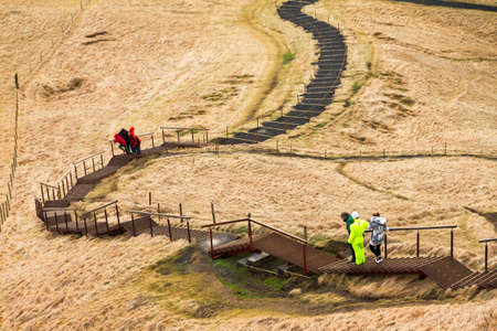 Staircase to the top of the Skogafoss waterfall in Icelandの写真素材