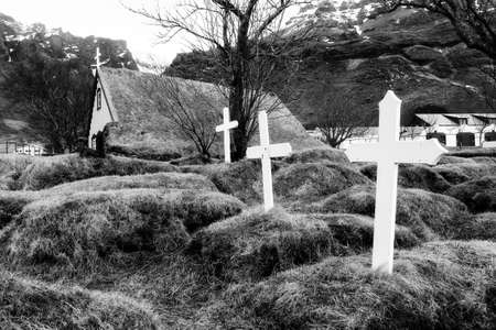 Beautiful old turf church and cemetery dating from 1883 in Hof, Iceland. Black and whiteの写真素材