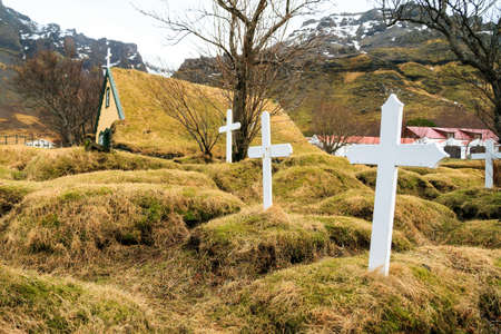Beautiful old turf church and cemetery dating from 1883 in Hof, Icelandの写真素材