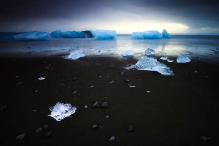 Beautiful beached chunks of ice at the beach at Jokulsarlon, Iceland, in winterの写真素材