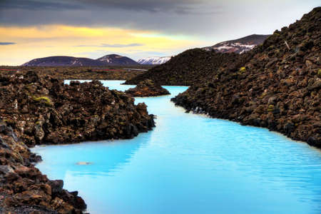 Blue lagoon waters in the lava field landscape of Iceland in winter, HDRの写真素材