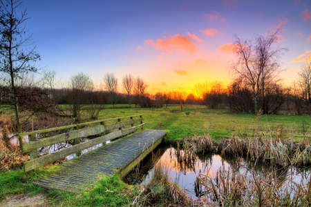 Beautiful sunset in polder park Cronesteyn in Leiden, the Netherlands. HDRの写真素材