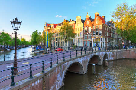 Beautiful sunset at the Emperors canal Keizersgracht canal in Amsterdam and Leiden in springの写真素材