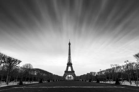 Beautiful long exposure view of the Eiffel tower on a cloudy winter day in Paris in black and whiteの写真素材
