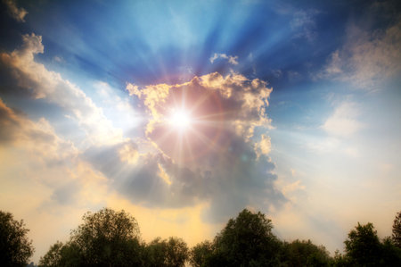 Divine light shines through the clouds with crepuscular rays