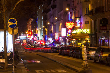 Boulevard the Clichy at night in the district of Montmartre with the  in Paris, France, on February 23, 2014のeditorial素材