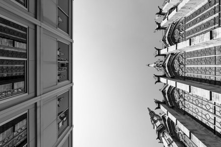 Beautiful ancient church next to a ugly modern building in Paris in BW