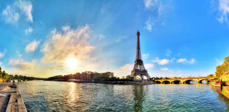 Beautiful 180 degree HDR panorama at sunrise in spring of the Eiffel tower at the river Seine in Paris, Franceの写真素材