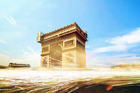 Composite timelapse image of passing traffic at the Arc de Triomphe in Paris, Franceの写真素材