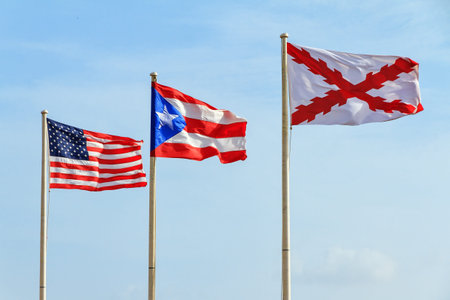 Flags of the Old Spanish military (Cross of Burgundy), Puerto Rico and America at fort San Cristobal in San Juan, Puerto Ricoの写真素材