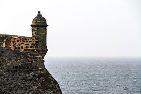 Beautiful view of the large outer wall with sentry box of fort San Cristobal in San Juan, Puerto...