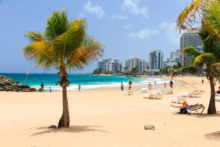 People relaxing at popular touristic Condado beach in San Juan, Puerto Rico, on June 11, 2014のeditorial素材