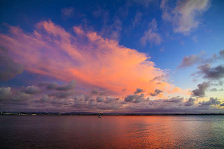 Amazing pink clouds at sunset in the Caribbean in San Juan, Puerto Ricoの写真素材