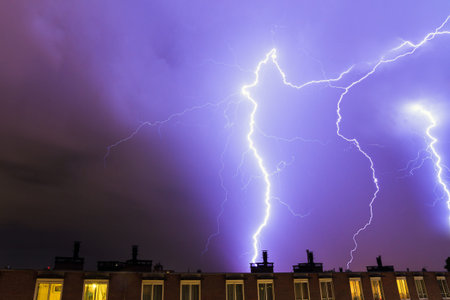 Heavy lightning flashes over Amsterdam, the Netherlands, during a storm in summer at night