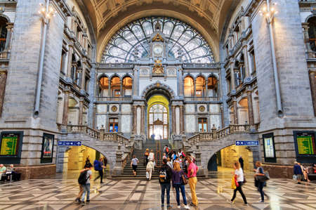 Tourists and commuters in the beautiful historic Antwerp Central Station in Antwerp, Belgium, on September 20, 2014のeditorial素材