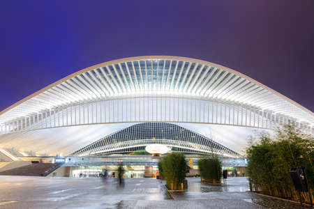 Beautiful view of the modern architecture railway station Liege-Guillemins with steel shapes and lines in the blue hour in Belgiumのeditorial素材