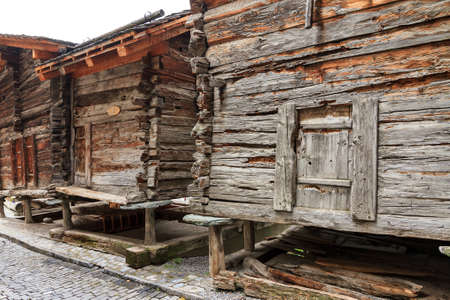 Beautiful traditional wooden houses in the streets of the alpine village Grimentz, Switzerland, in the canton Valais, municipality Anniviersの写真素材