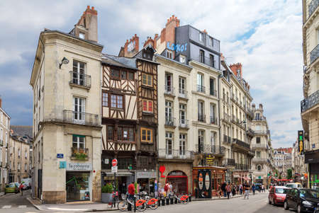 Beautiful cityscape view of the generic architecture of the houses with shops in Nantes, France, with people in the streets on July 29, 2014のeditorial素材