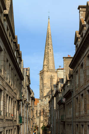 Beautiful urban cityscape view of the Saint-Malo cathedral bell tower in Brittany, France, a Roman Catholic churchの写真素材