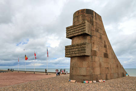 Tourists visit the D-day monument on Omaha beach in Normandy, France, on August 2, 2014のeditorial素材