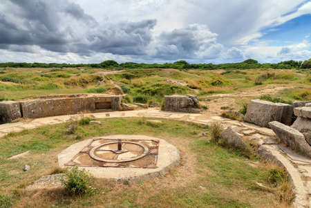 Beautiful view of the remains of German bunkers at the Pointe du Hoc in the dunes of Normandy, France, a WW2 memorial siteの写真素材