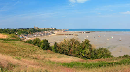 Beautiful cityscape view of the skyline and beach at low tide of the city Cancale, France, in summerの写真素材