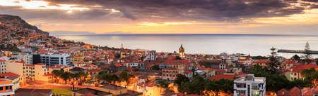 Beautiful panoramic cityscape of Funchal on the island Madeira at sunrise in summerの写真素材