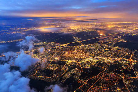 Beautiful aerial cityscape view of the city of Leiden, the Netherlands, after sunset at night in the blue hourの写真素材