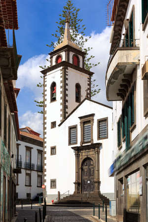 Beautiful vibrant cityscape in the streets of Funchal, Madeira, with the Parish or Sao Pedro on a summer dayの写真素材