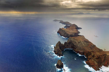 Beautiful dramatic aerial landscape panorama of the island Madeira from Ponta de Sao Lourenco nature reserve at sunriseの写真素材