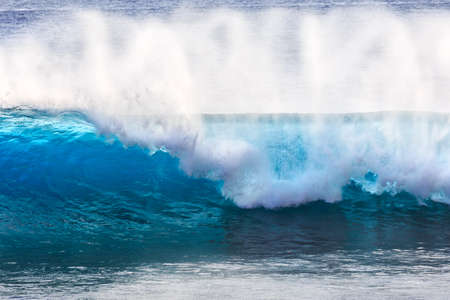 Beautiful seascape view of the big blue surf waves of the Atlantic ocean on the island Madeira, a popular surfing tourist destinationの写真素材