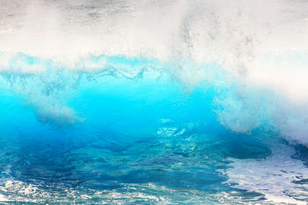 Beautiful seascape view of the big blue surf waves of the Atlantic ocean on the island Madeira, a popular surfing tourist destinationの写真素材