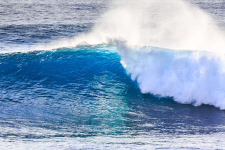 Beautiful seascape view of the big blue surf waves of the Atlantic ocean on the island Madeira, a popular surfing tourist destinationの写真素材