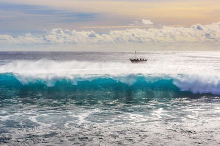 Beautiful seascape view of the big blue surf waves of the Atlantic ocean on the island Madeira, a popular surfing tourist destinationの写真素材