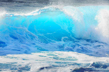 Beautiful seascape view of the big blue surf waves of the Atlantic ocean on the island Madeira, a popular surfing tourist destinationの写真素材