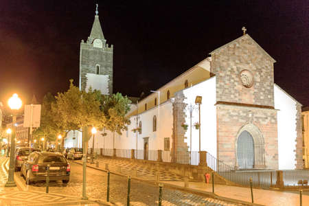 Cityscape of the Cathedral of Our Lady of the Assumption (Portuguese, Catedral de Nossa Senhora da Assuncao) in Se, Funchal, Madeira, Portugal, at nightの写真素材