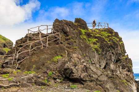 Beautiful viewpoint on the north coast of Madeira at Seixal, on a summer day with blue skyの写真素材