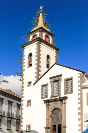 Beautiful vibrant cityscape in the streets of Funchal, Madeira, with the Parish or Sao Pedro on a summer dayの写真素材