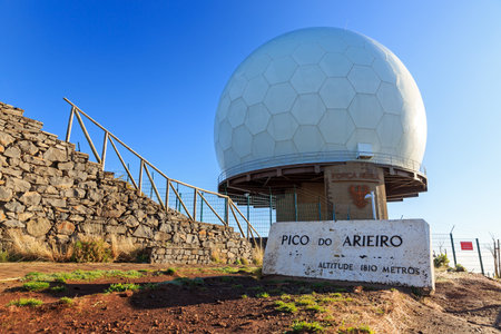 Beautiful blue sky morning view of the top of the Pico do Arieiro in the mountains of Madeira on summer dayの写真素材